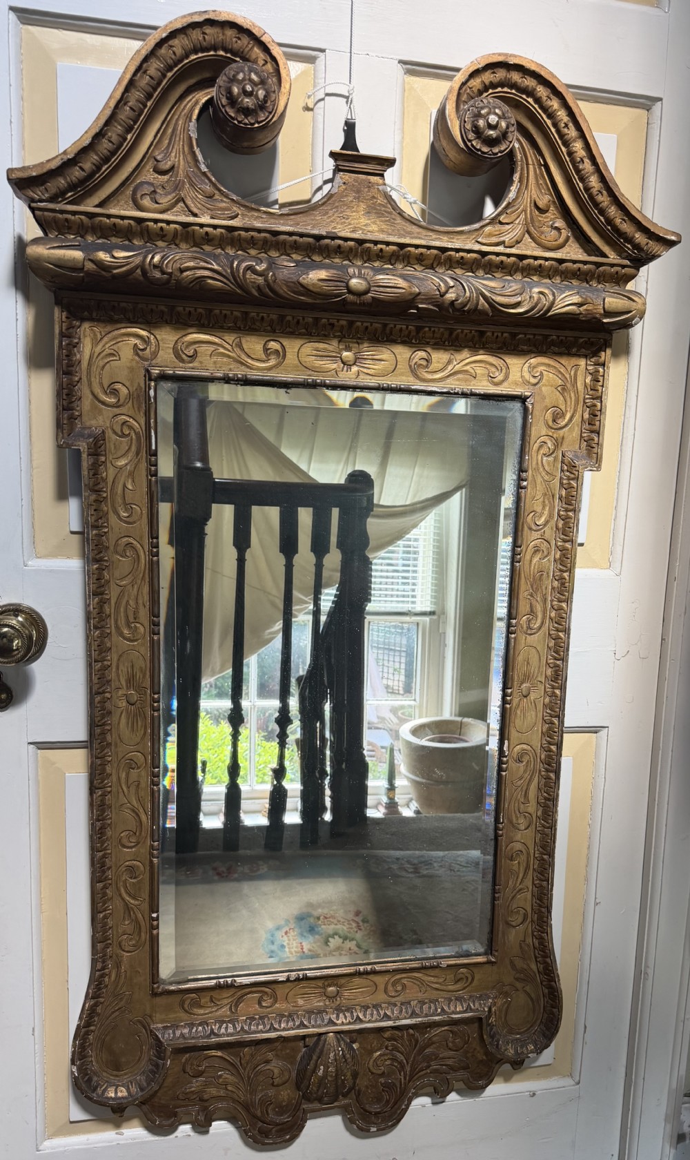 Mid 19th-century George II style carved giltwood pier mirror featuring a swan-neck pediment and carved shell apron. View IV