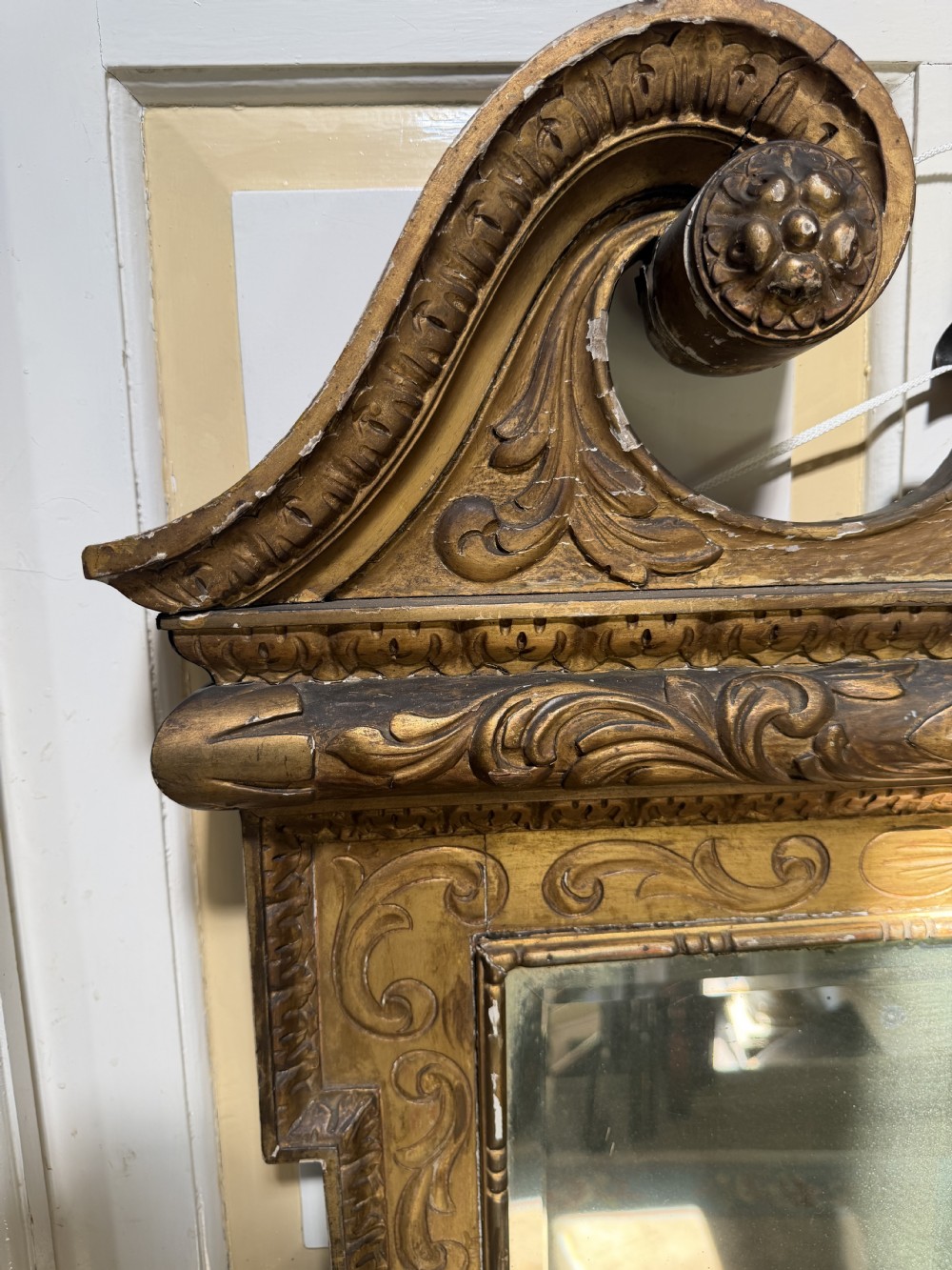Mid 19th-century George II style carved giltwood pier mirror featuring a swan-neck pediment and carved shell apron. View XIV