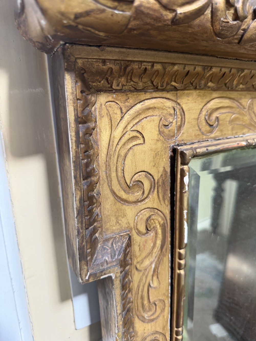 Mid 19th-century George II style carved giltwood pier mirror featuring a swan-neck pediment and carved shell apron. View XV