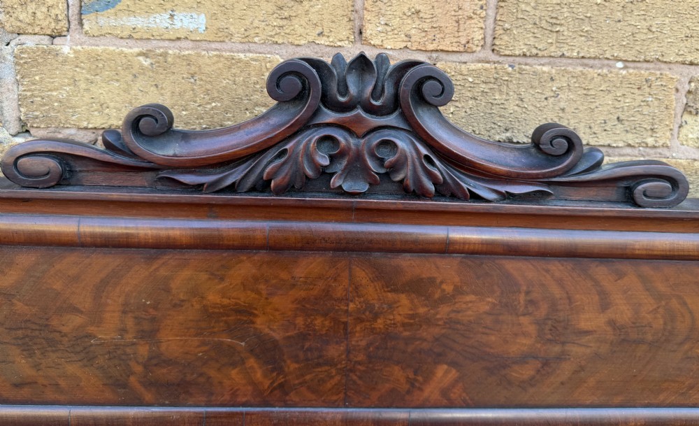 A large early 19th-century George IV mahogany serving table featuring a raised gallery back with carved cresting, carved cabriole front legs, and lion paw feet. View XI