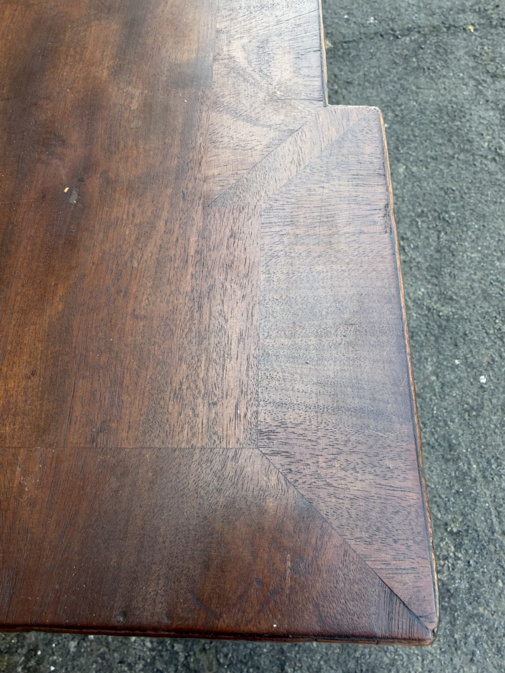 A large early 19th-century George IV mahogany serving table featuring a raised gallery back with carved cresting, carved cabriole front legs, and lion paw feet. View XIX