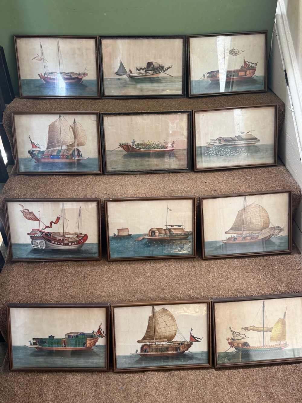 A set of twelve late nineteenth-century framed Chinese export gouache paintings depicting various traditional junks and maritime vessels against light neutral backgrounds.