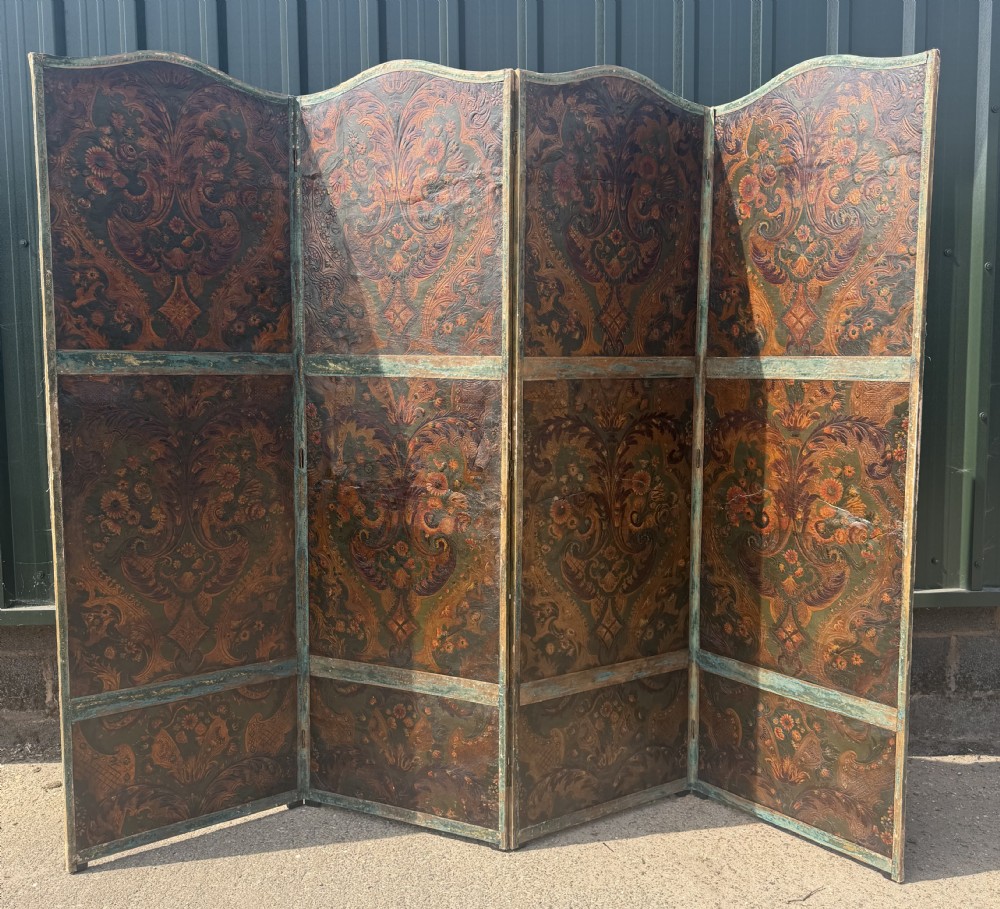 A late nineteenth-century four-fold canvas room screen featuring polychrome floral and scroll decoration in warm brown and green tones with serpentine cresting. View IX