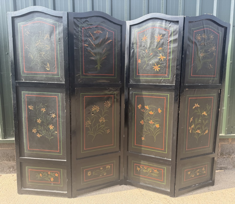 A late nineteenth-century four-fold canvas room screen featuring polychrome floral and scroll decoration in warm brown and green tones with serpentine cresting. View X