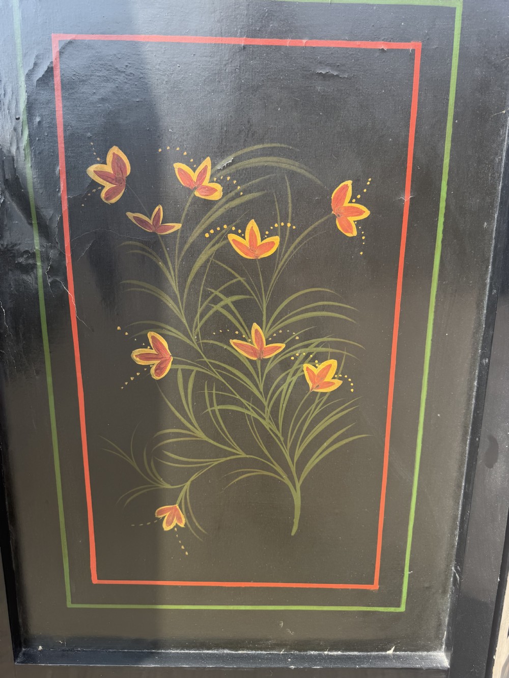 A late nineteenth-century four-fold canvas room screen featuring polychrome floral and scroll decoration in warm brown and green tones with serpentine cresting. View XI