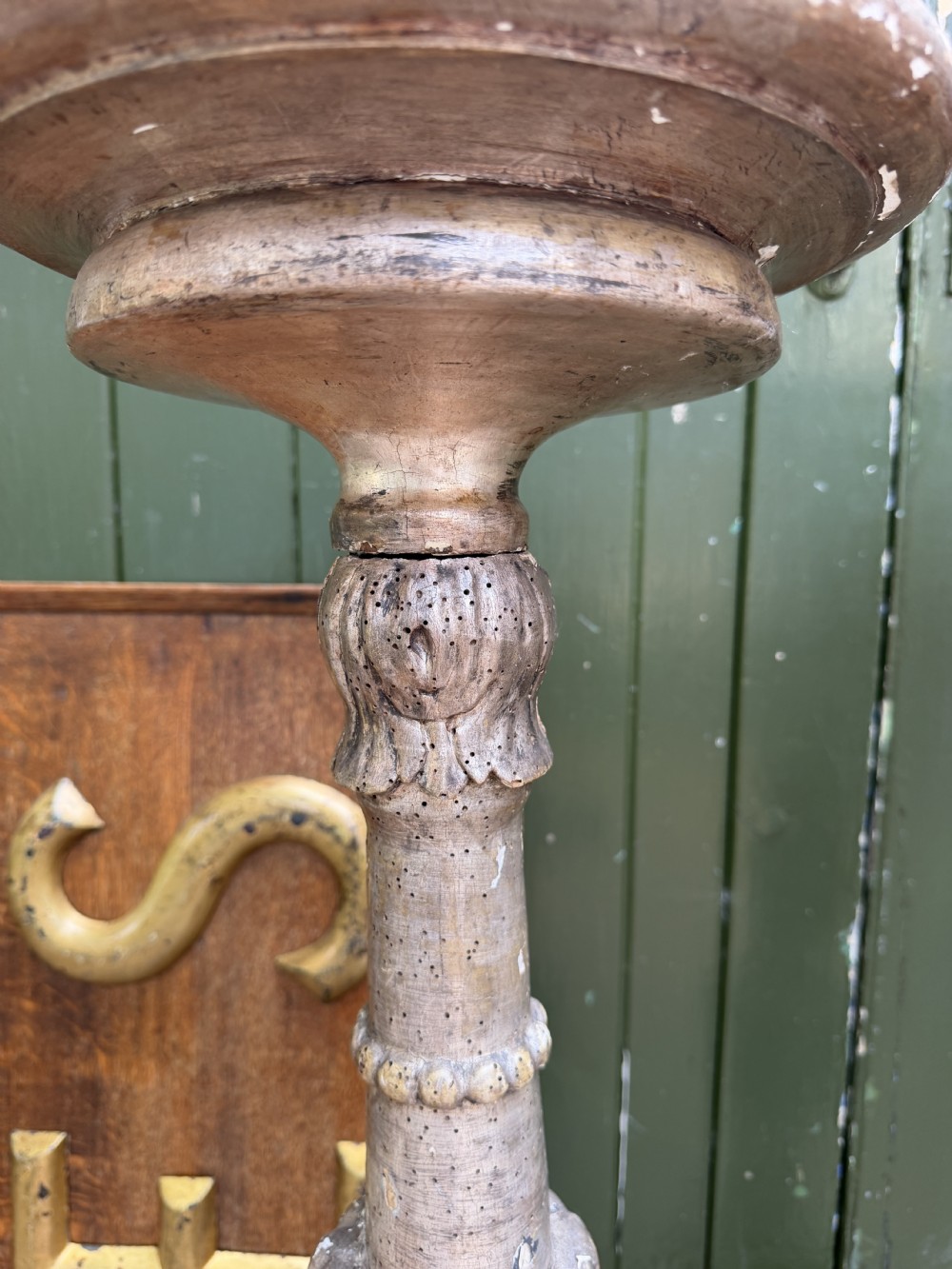 A pair of tall 18th-century Italian carved wood torcheres featuring baluster turned shafts with acanthus leaf details and an aged silver leaf finish. View VI