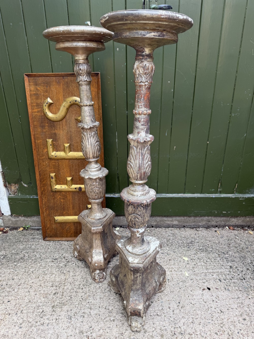A pair of tall 18th-century Italian carved wood torcheres featuring baluster turned shafts with acanthus leaf details and an aged silver leaf finish. View XII