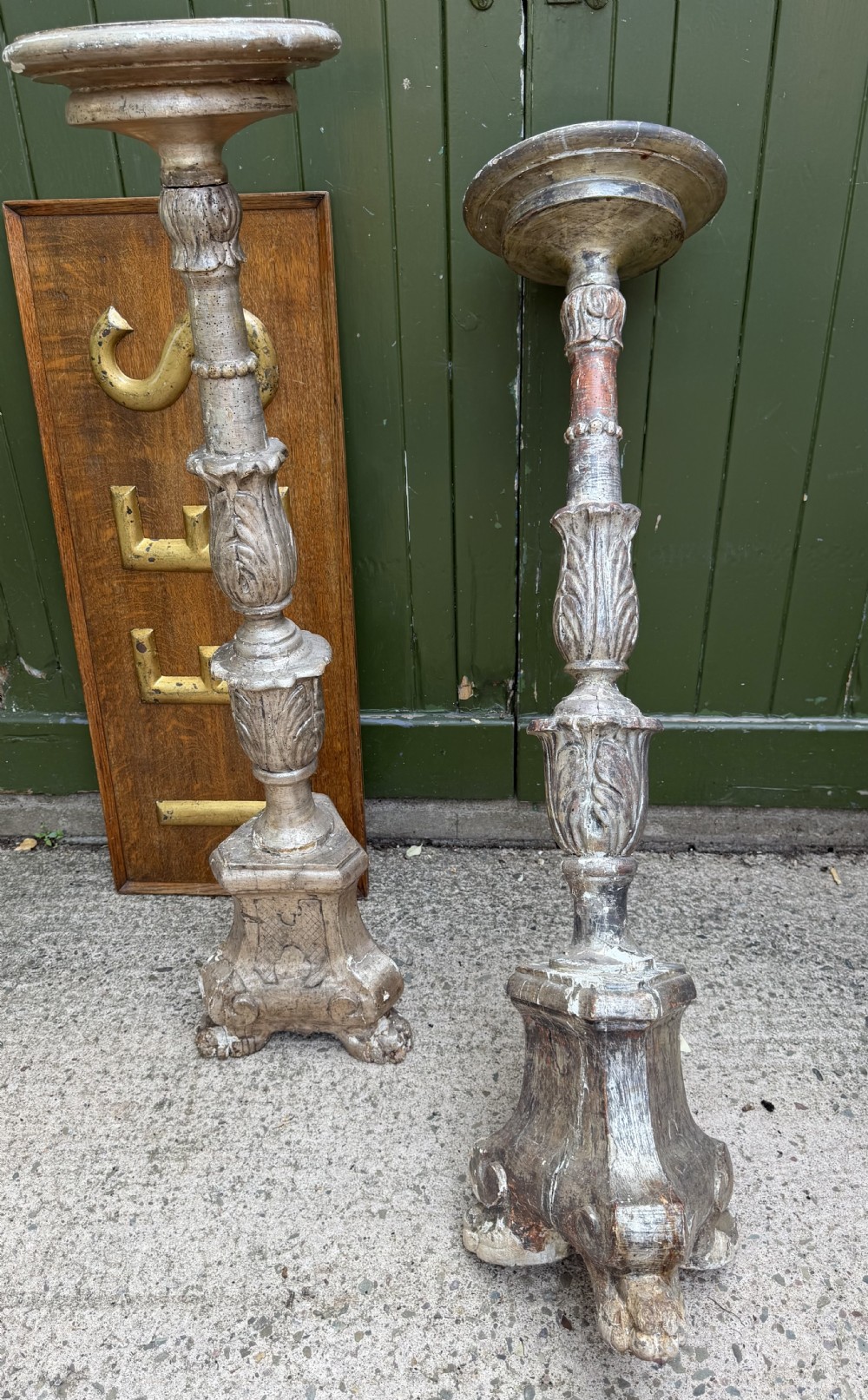 A pair of tall 18th-century Italian carved wood torcheres featuring baluster turned shafts with acanthus leaf details and an aged silver leaf finish. View XV
