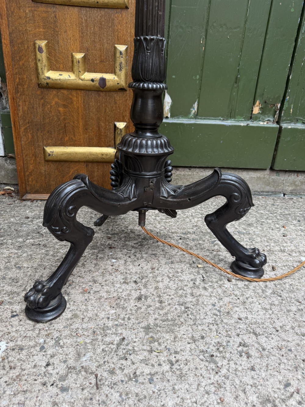 A tall late nineteenth-century cast-iron standard lamp with a dark bronze patinated finish, featuring a fluted column shaft, acanthus leaf moulding, and a tripod claw foot base. View XII