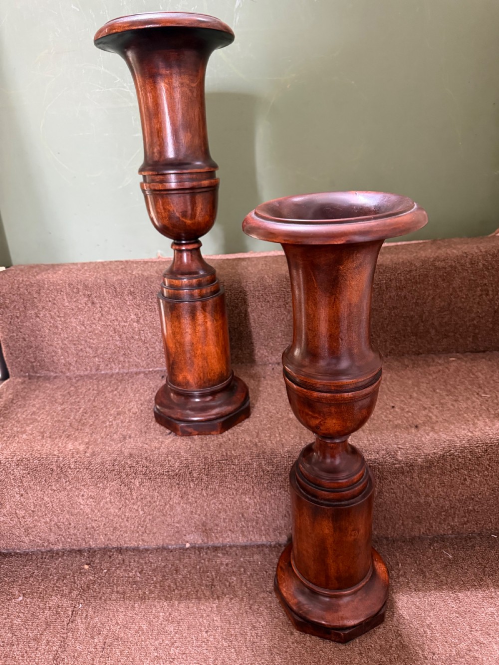 A pair of 19th-century turned walnut decorative vases featuring flared tops, baluster-turned stems, and stepped octagonal bases. View II