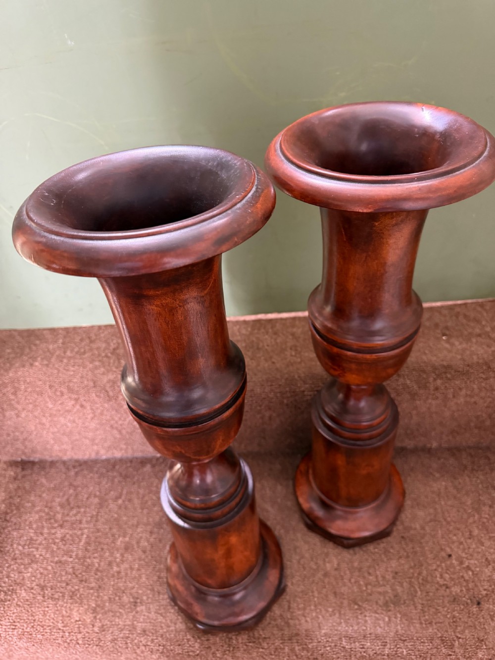 A pair of 19th-century turned walnut decorative vases featuring flared tops, baluster-turned stems, and stepped octagonal bases. View V