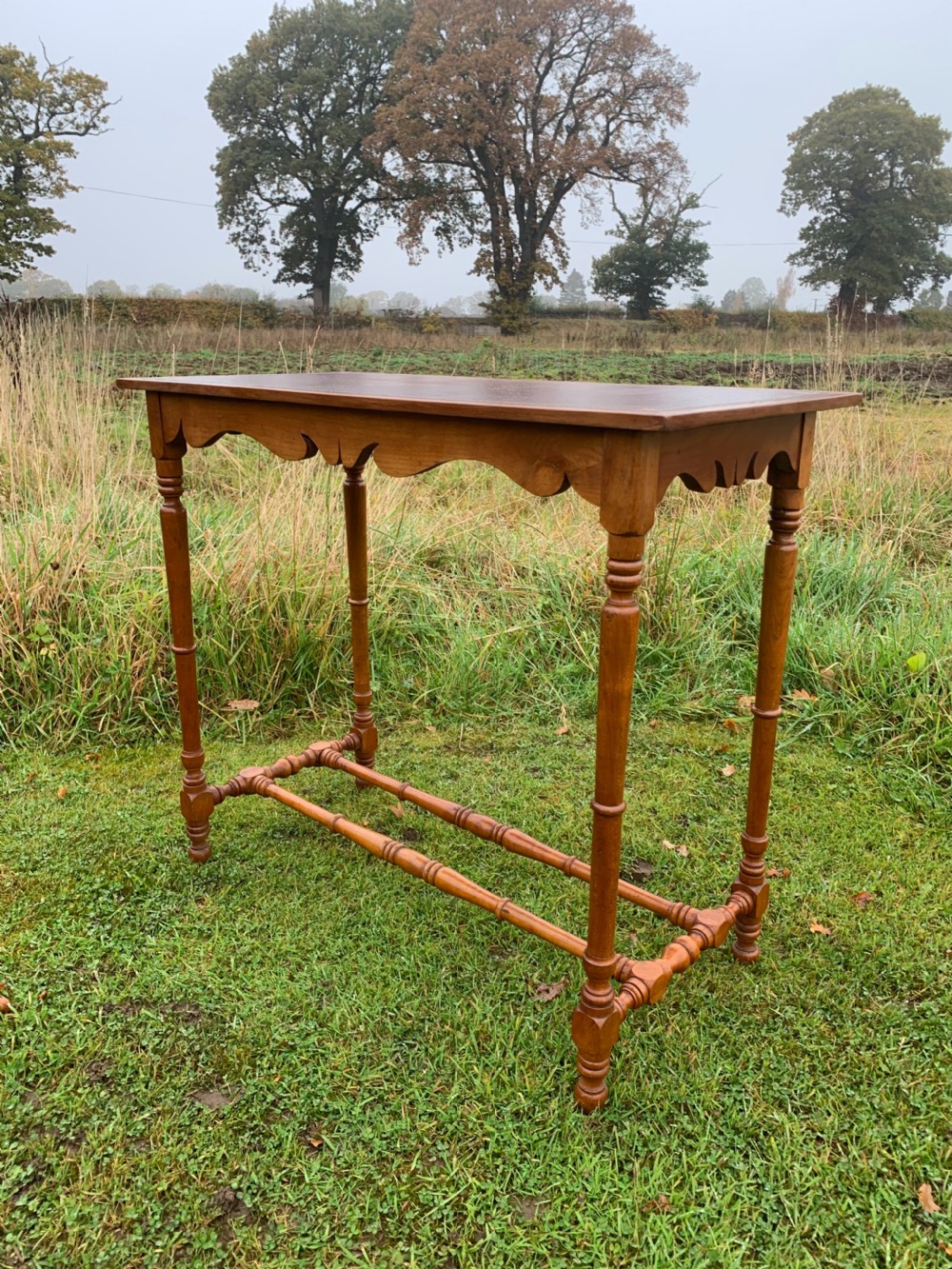 Elegant narrow walnut side table 