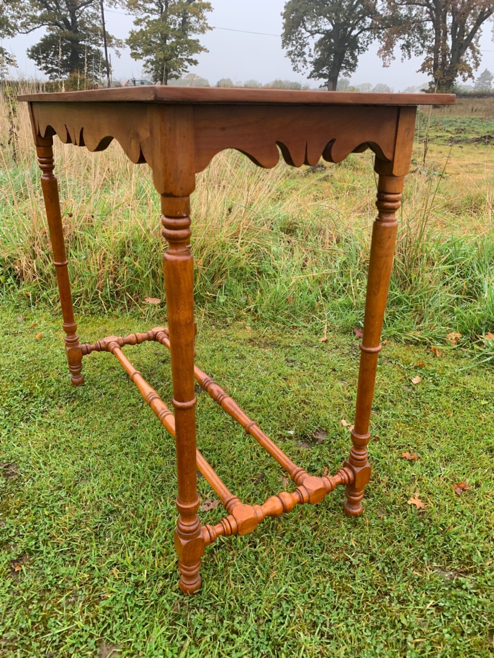 Elegant narrow walnut side table  View II