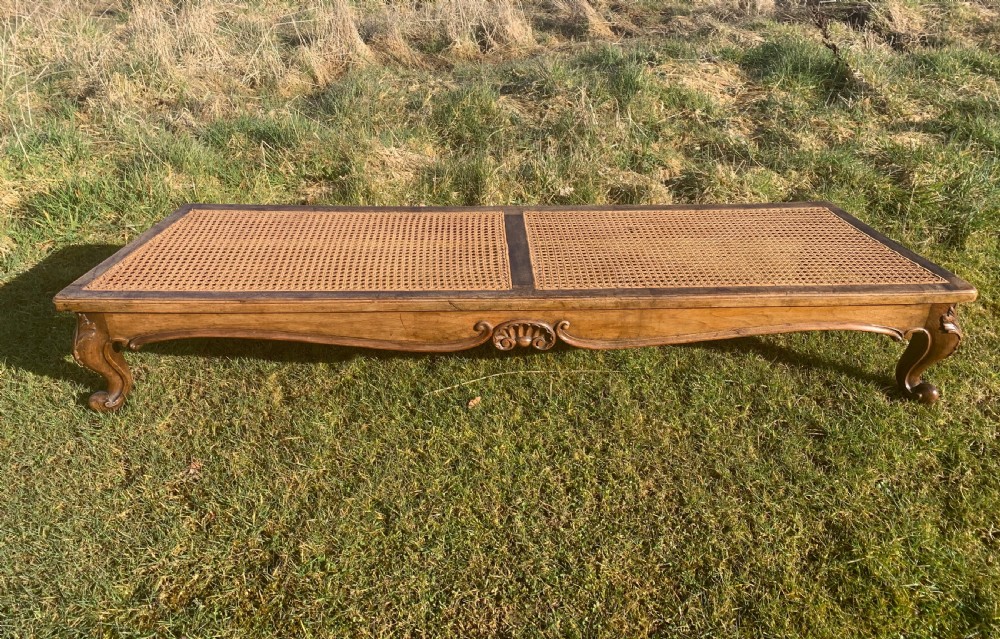 Walnut caned window seat