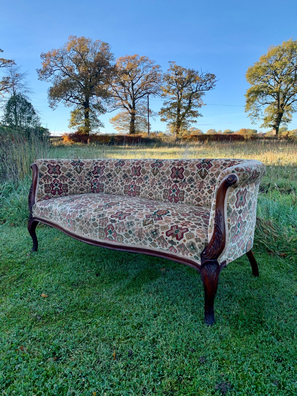 Tiny carved mahogany sofa View II