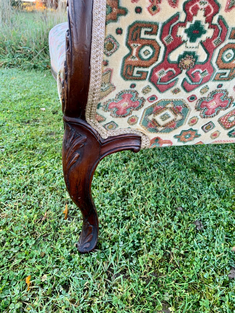 Tiny carved mahogany sofa View X