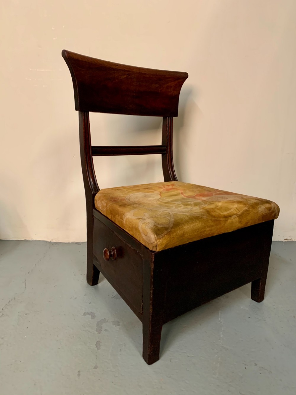 Unusual low chair with drawer 
