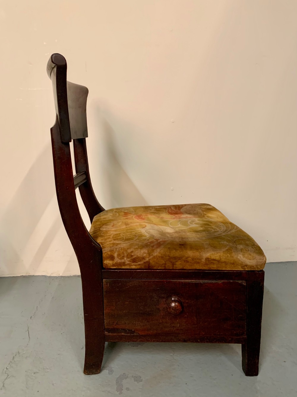 Unusual low chair with drawer  View II
