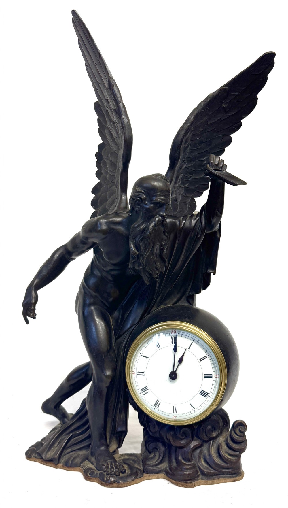A dark bronze sculptural mantel clock featuring a winged figure of Father Time holding a scythe alongside a round clock face with Roman numerals. View IX