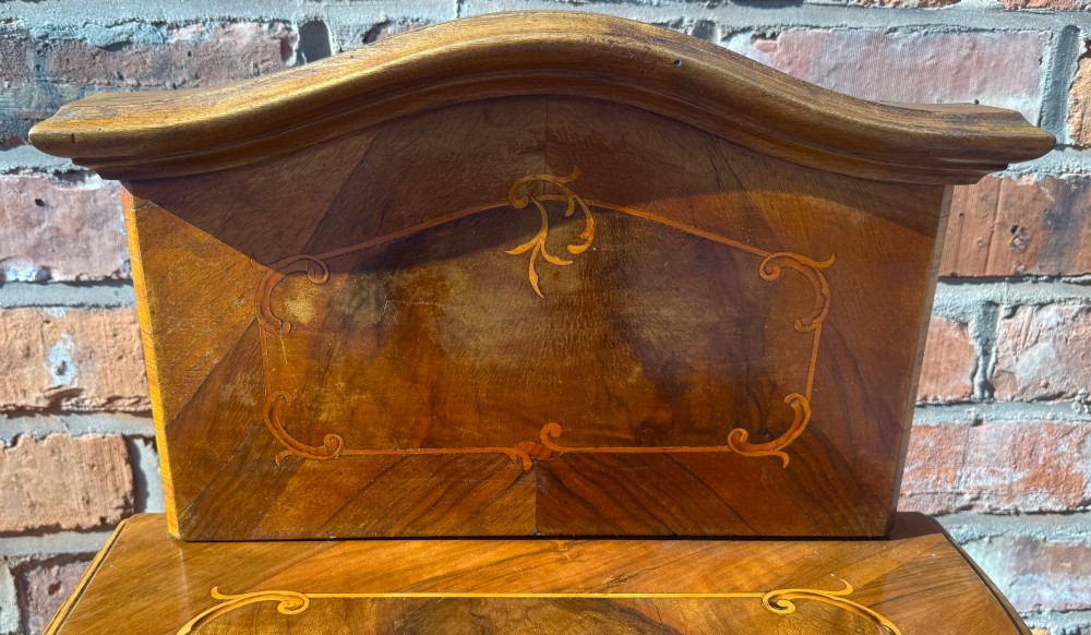 A pair of antique inlaid satinwood bedside cabinets featuring curved sides, decorative marquetry, shaped top galleries, and single doors with ornate brass handles. View XIII