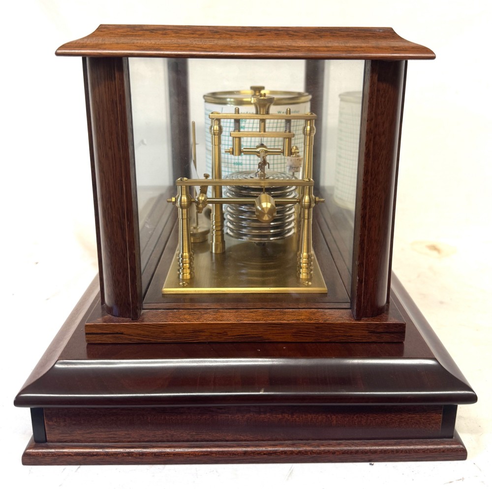 An antique mahogany and brass barograph housed inside a rectangular glazed display case with an internal paper chart drum. View IV