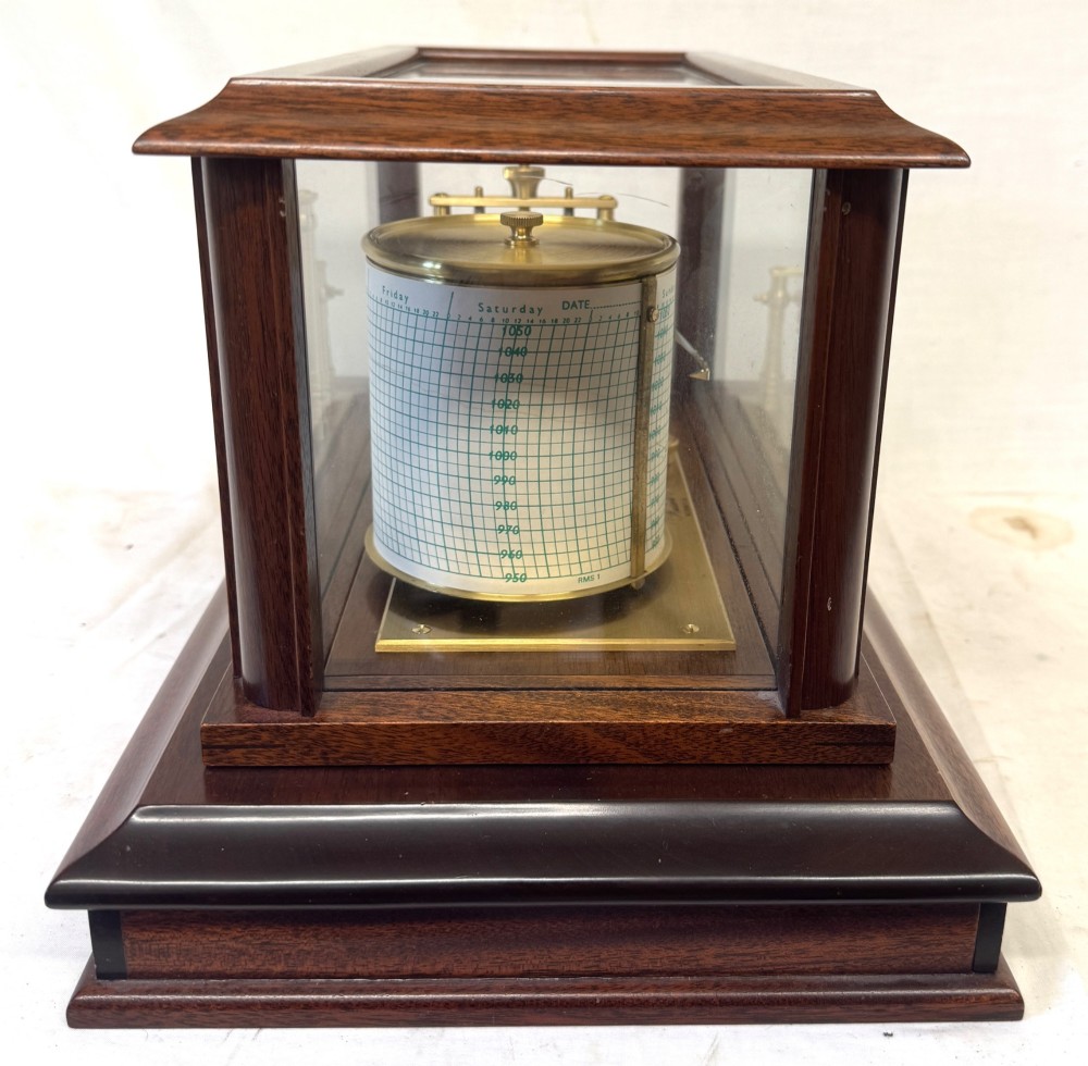 An antique mahogany and brass barograph housed inside a rectangular glazed display case with an internal paper chart drum. View VI