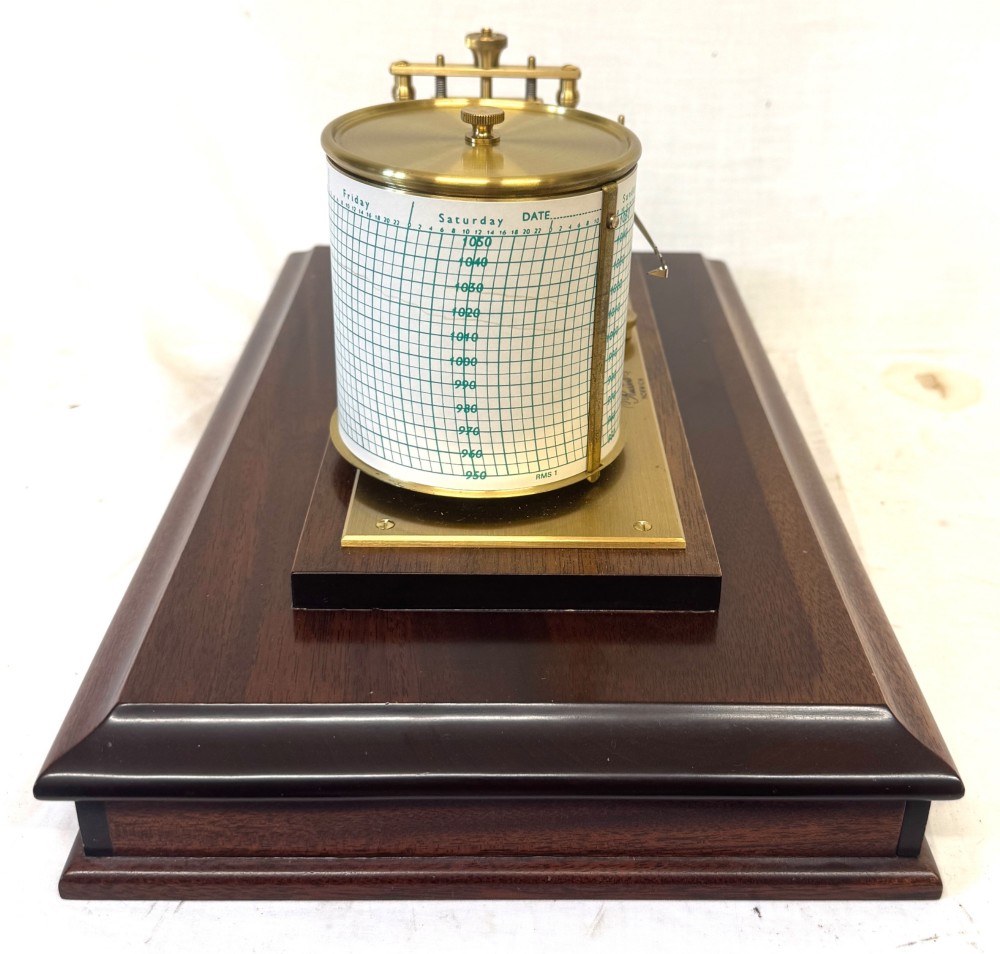 An antique mahogany and brass barograph housed inside a rectangular glazed display case with an internal paper chart drum. View XI