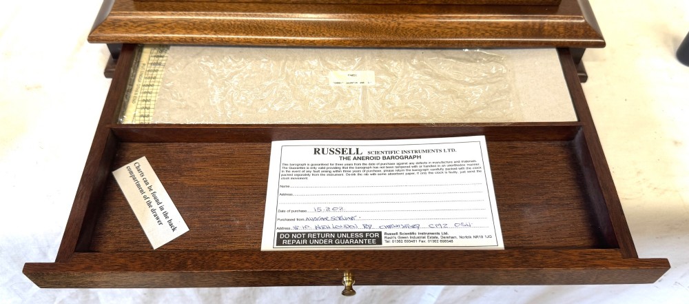 An antique mahogany and brass barograph housed inside a rectangular glazed display case with an internal paper chart drum. View XV