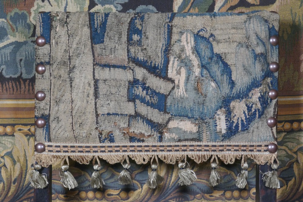 A pair of 17th-century oak back stools upholstered in tapestry fabric with tassel trim and turned legs. View VII