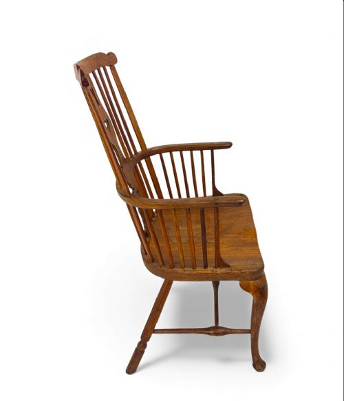 An 18th-century Thames Valley Windsor armchair featuring a high comb back with spindles, a pierced heart splat, a contoured saddle seat, and cabriole front legs. View VI