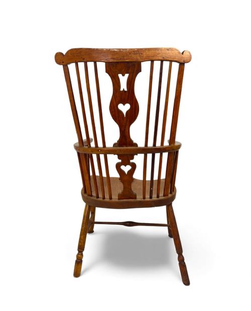 An 18th-century Thames Valley Windsor armchair featuring a high comb back with spindles, a pierced heart splat, a contoured saddle seat, and cabriole front legs. View VII