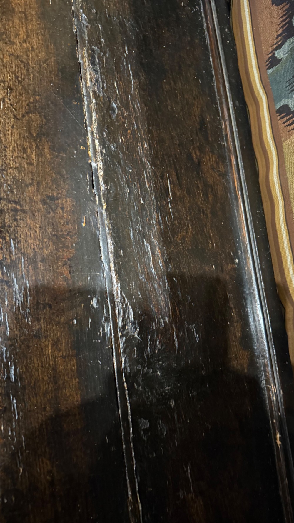 A 17th-century carved oak livery cupboard featuring inlaid wooden panels, carved lion supports, and bulbous turned legs. View XIX