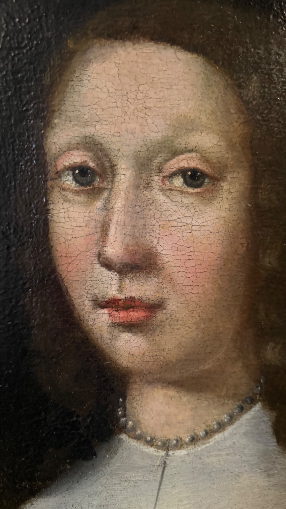 A pair of 17th-century Dutch oil portraits depicting a gentleman and a lady in period attire, set within matching burr walnut frames. View XVII