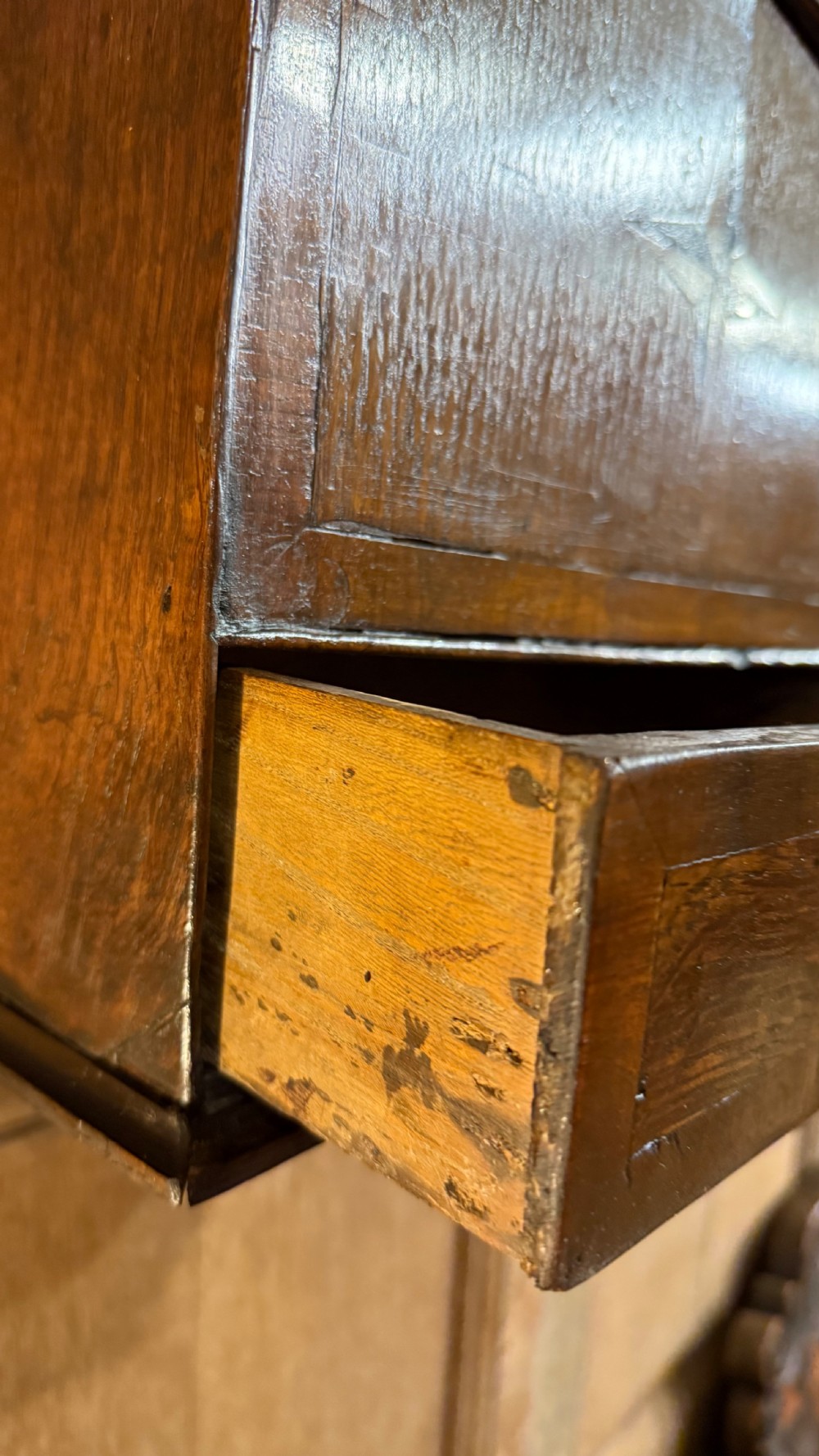 A 19th-century wall-mounted oak box featuring a star marquetry inlay, a heart-shaped hanging cut-out, and a lower drawer with a metal ring pull. View VII