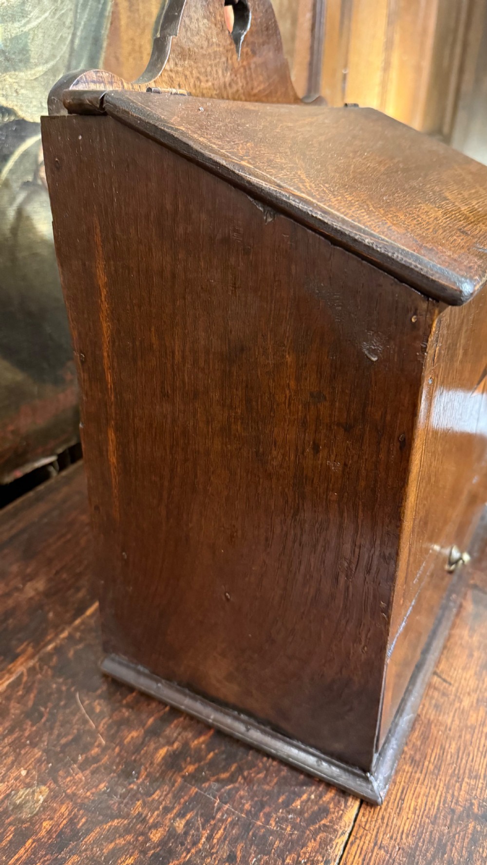 A 19th-century wall-mounted oak box featuring a star marquetry inlay, a heart-shaped hanging cut-out, and a lower drawer with a metal ring pull. View X