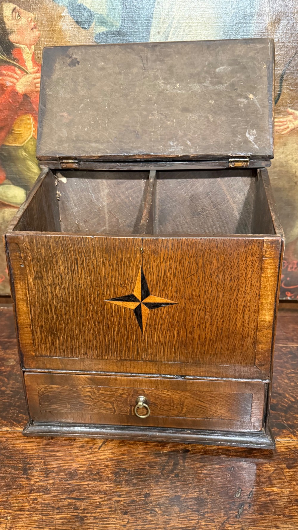 A 19th-century wall-mounted oak box featuring a star marquetry inlay, a heart-shaped hanging cut-out, and a lower drawer with a metal ring pull. View XI