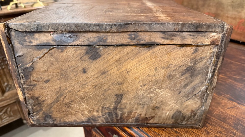 A 19th-century wall-mounted oak box featuring a star marquetry inlay, a heart-shaped hanging cut-out, and a lower drawer with a metal ring pull. View XV