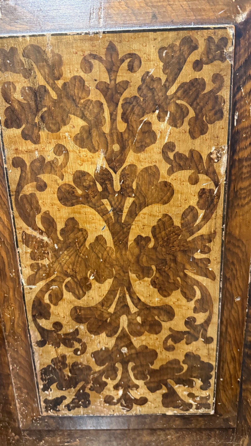 A nineteenth-century warm brown wooden tabletop collectors cabinet featuring intricate foliate marquetry inlay panels on the twin doors and top. View XV