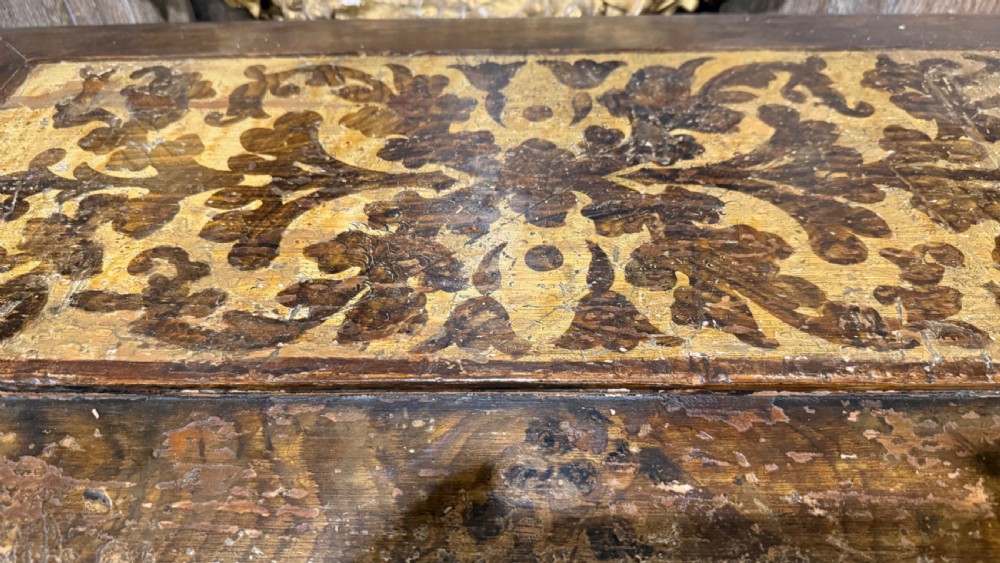 A nineteenth-century warm brown wooden tabletop collectors cabinet featuring intricate foliate marquetry inlay panels on the twin doors and top. View XVIII