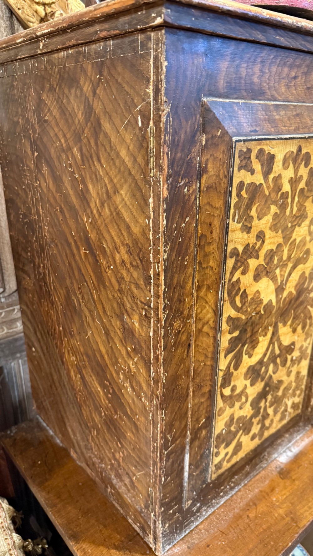 A nineteenth-century warm brown wooden tabletop collectors cabinet featuring intricate foliate marquetry inlay panels on the twin doors and top. View XXIII