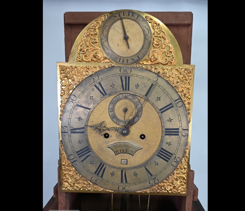 An 18th-century black japanned longcase clock decorated with gold chinoiserie scenes and featuring an arched brass dial. View III