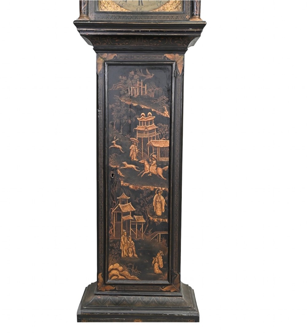 An 18th-century black japanned longcase clock decorated with gold chinoiserie scenes and featuring an arched brass dial. View VII