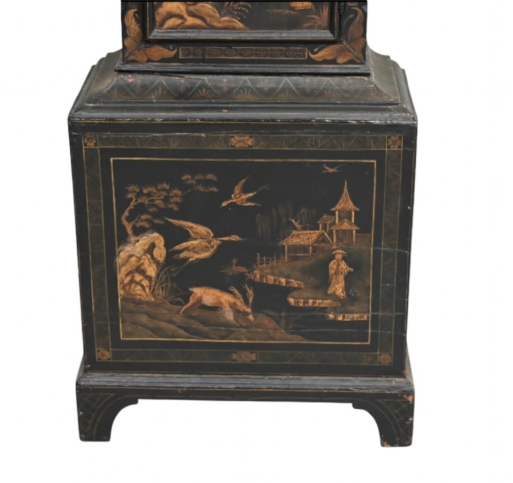 An 18th-century black japanned longcase clock decorated with gold chinoiserie scenes and featuring an arched brass dial. View VIII