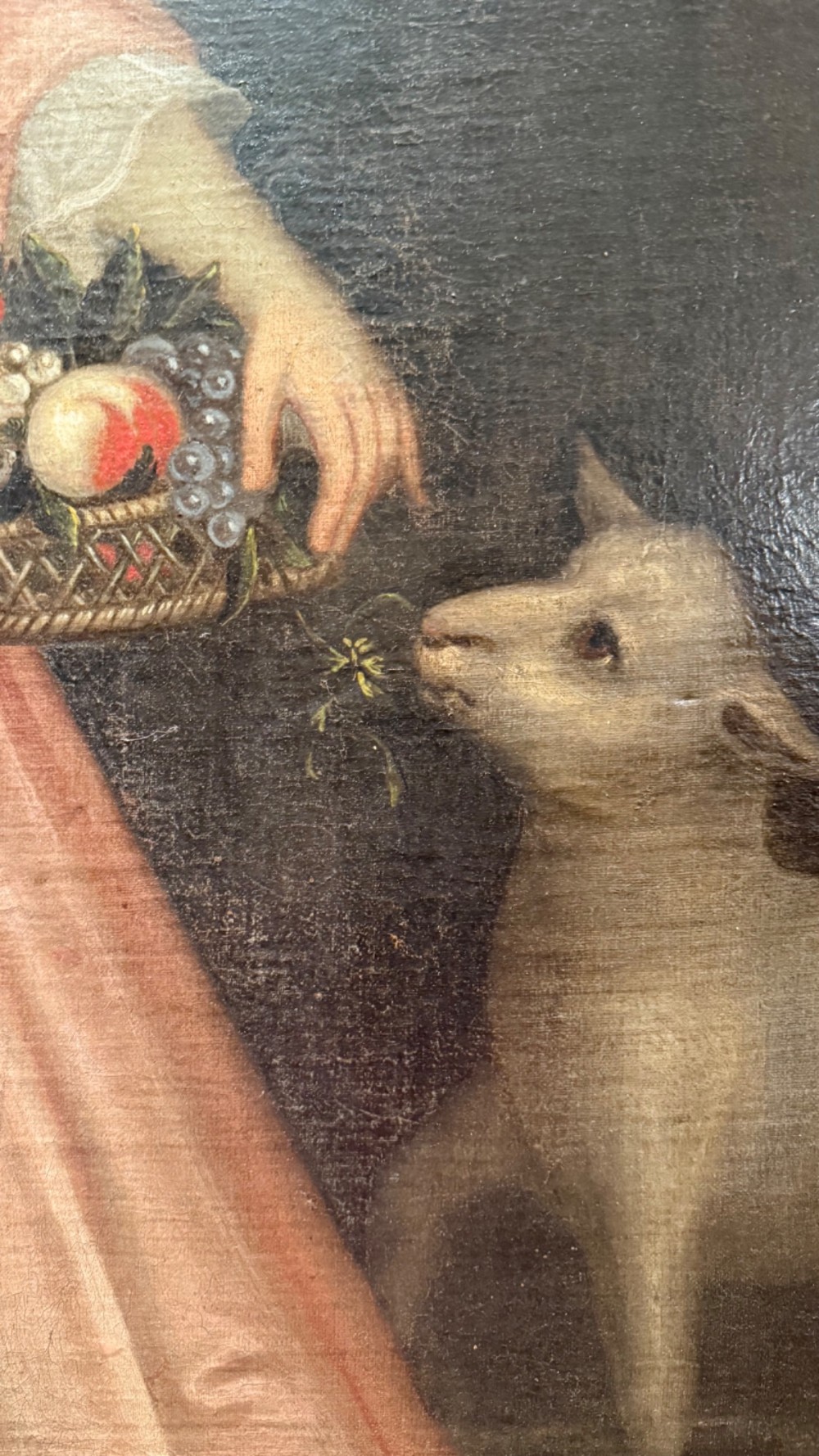 An eighteenth-century oil painting of a young girl in a pink dress holding a floral wreath, set alongside a lamb within an elaborate gold gilt frame. View X