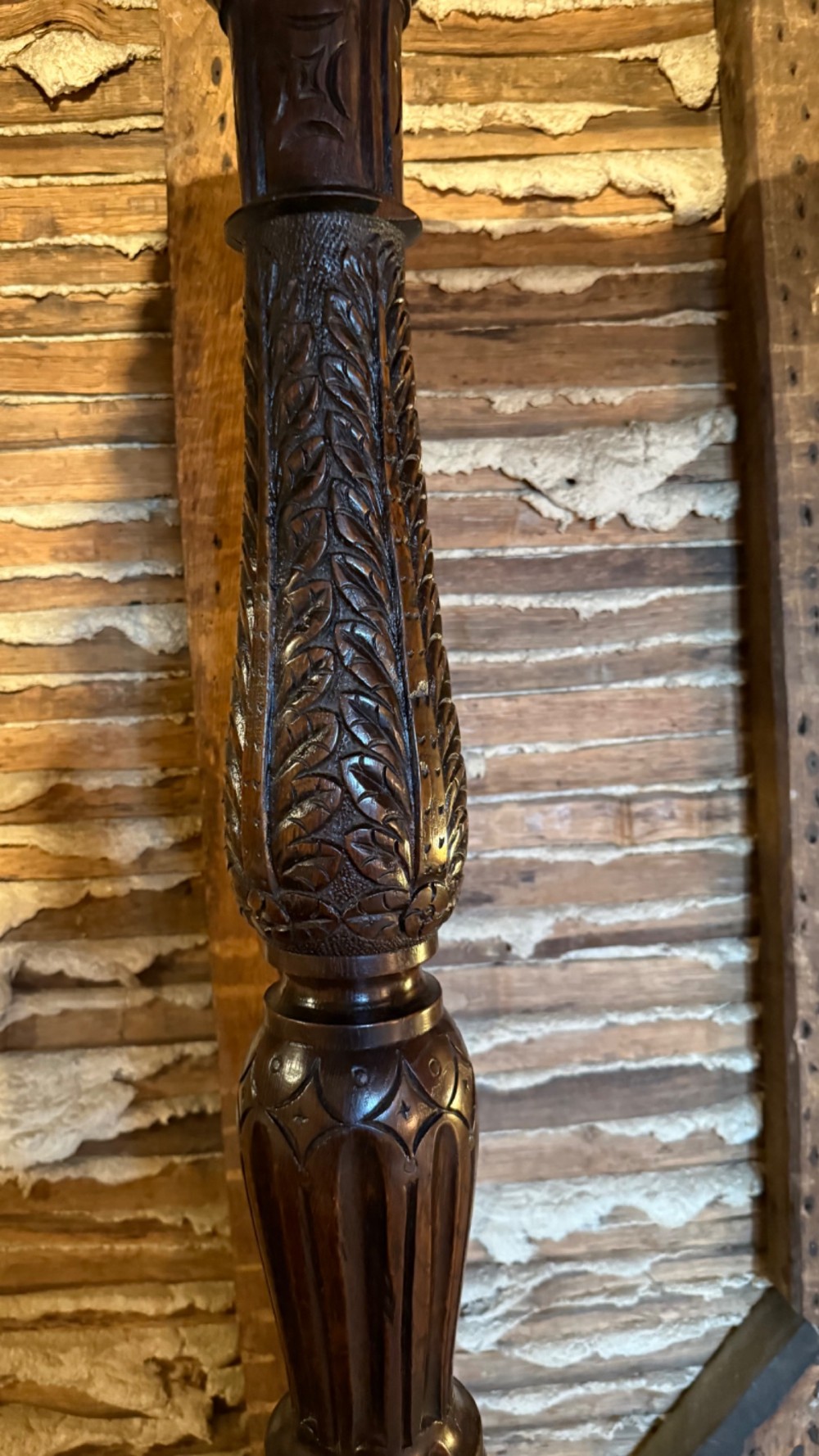 A 17th-century English oak tester bed featuring a heavy panelled canopy, carved geometric headboard, and turned wooden posts. View IX