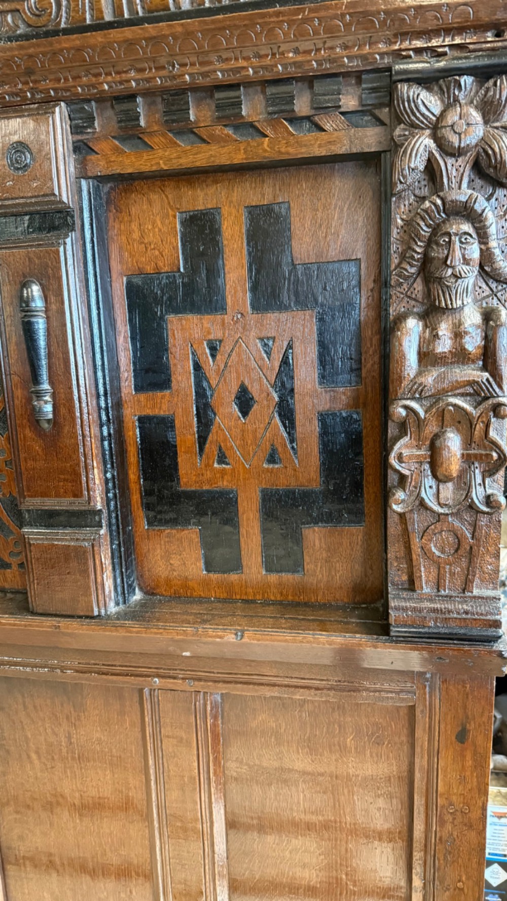 A 17th-century English oak tester bed featuring a heavy panelled canopy, carved geometric headboard, and turned wooden posts. View XIII