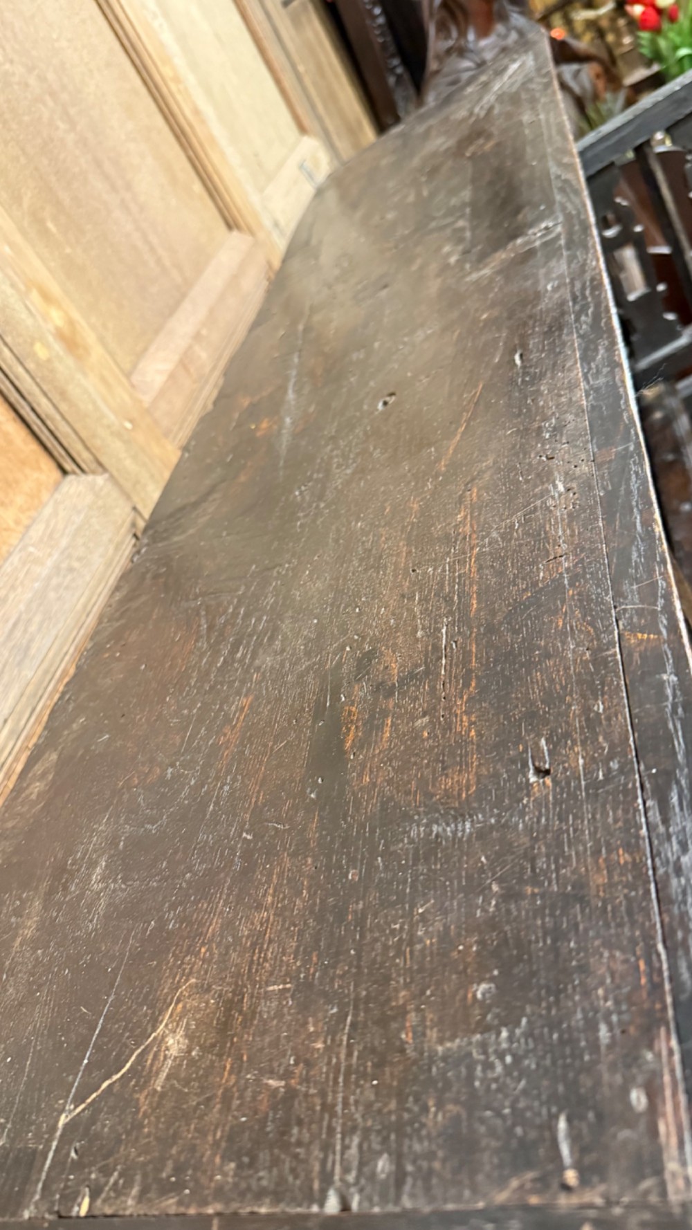 A dark oak seventeenth-century hanging cupboard featuring two upper tiers with carved pierced balusters and three small drawers with teardrop handles along the base. View XIV