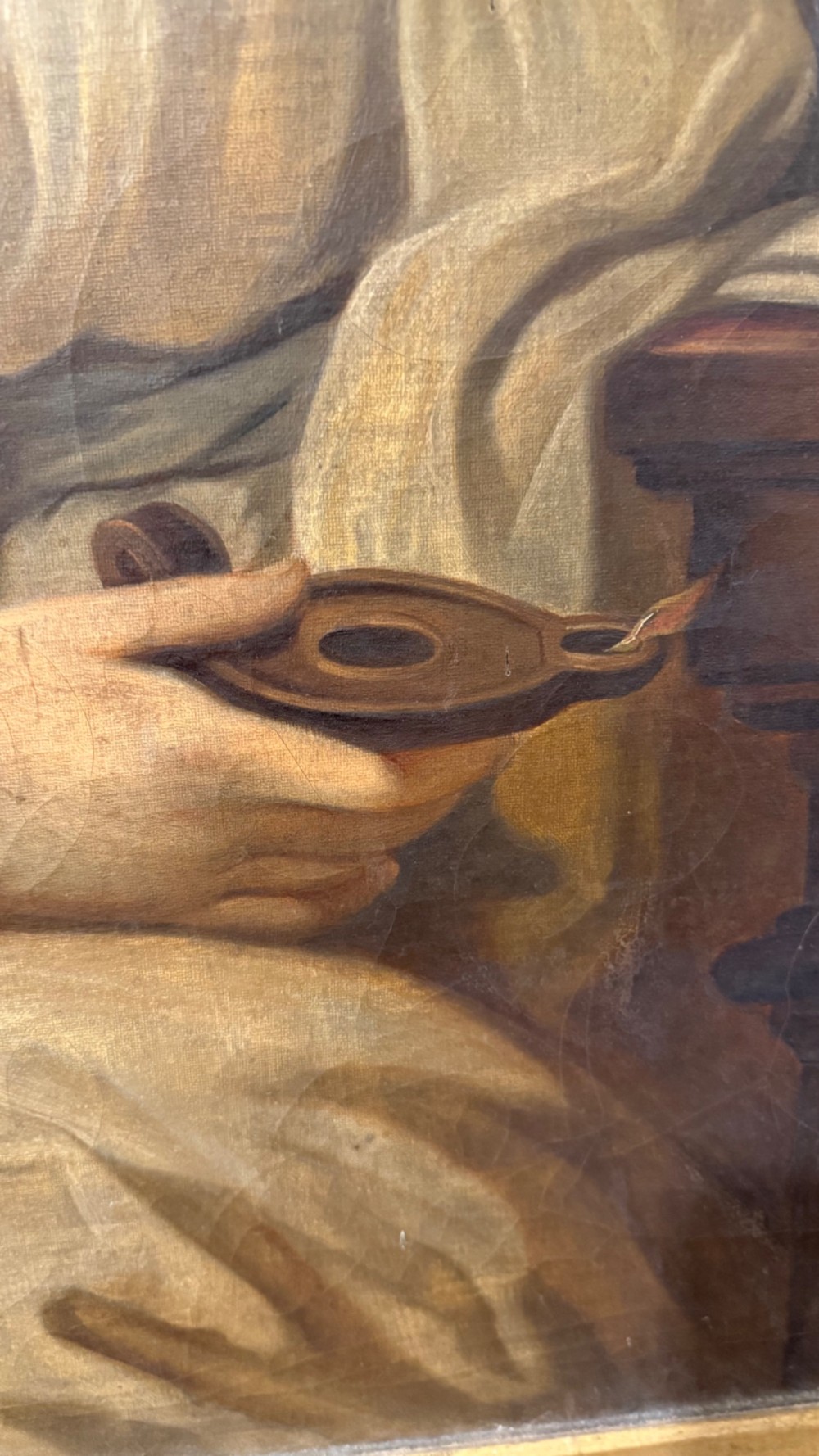 A nineteenth-century oil portrait of a draped woman holding a small lamp, housed within an ornate gilded frame. View VI