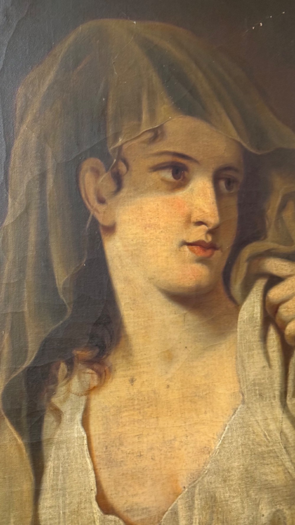A nineteenth-century oil portrait of a draped woman holding a small lamp, housed within an ornate gilded frame. View XII