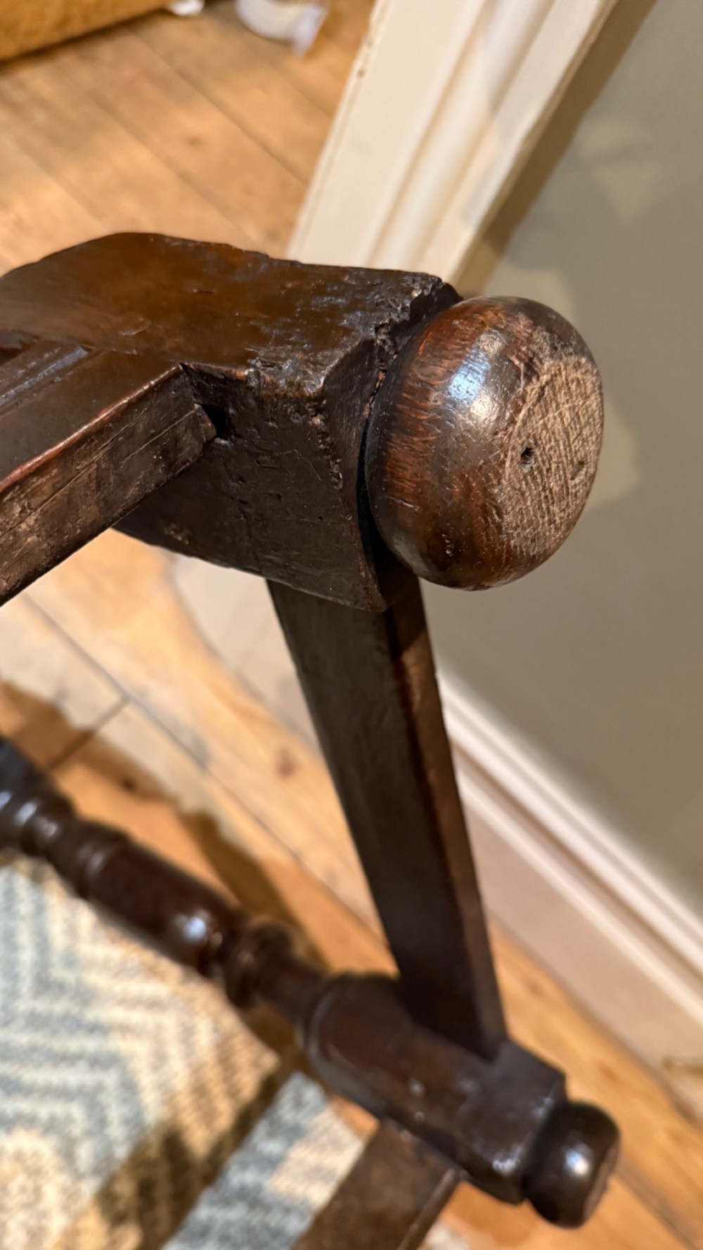 A dark oak 17th-century centre table featuring a carved fan-pattern apron, turned baluster legs, and sturdy wooden stretchers. View XIII